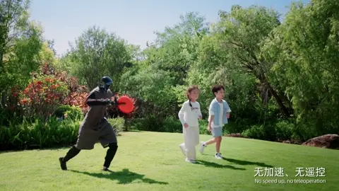 Graphic of a Unitree humanoid robot joining children in a game of frisbee.