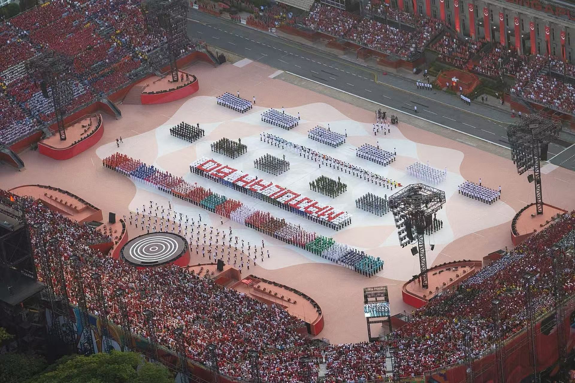 Photo shows the completed showcase project, where line markings by Partner Robotics’ robot segmented the performance area into white-tinted zones to guide formations for the 60th National Day celebration.