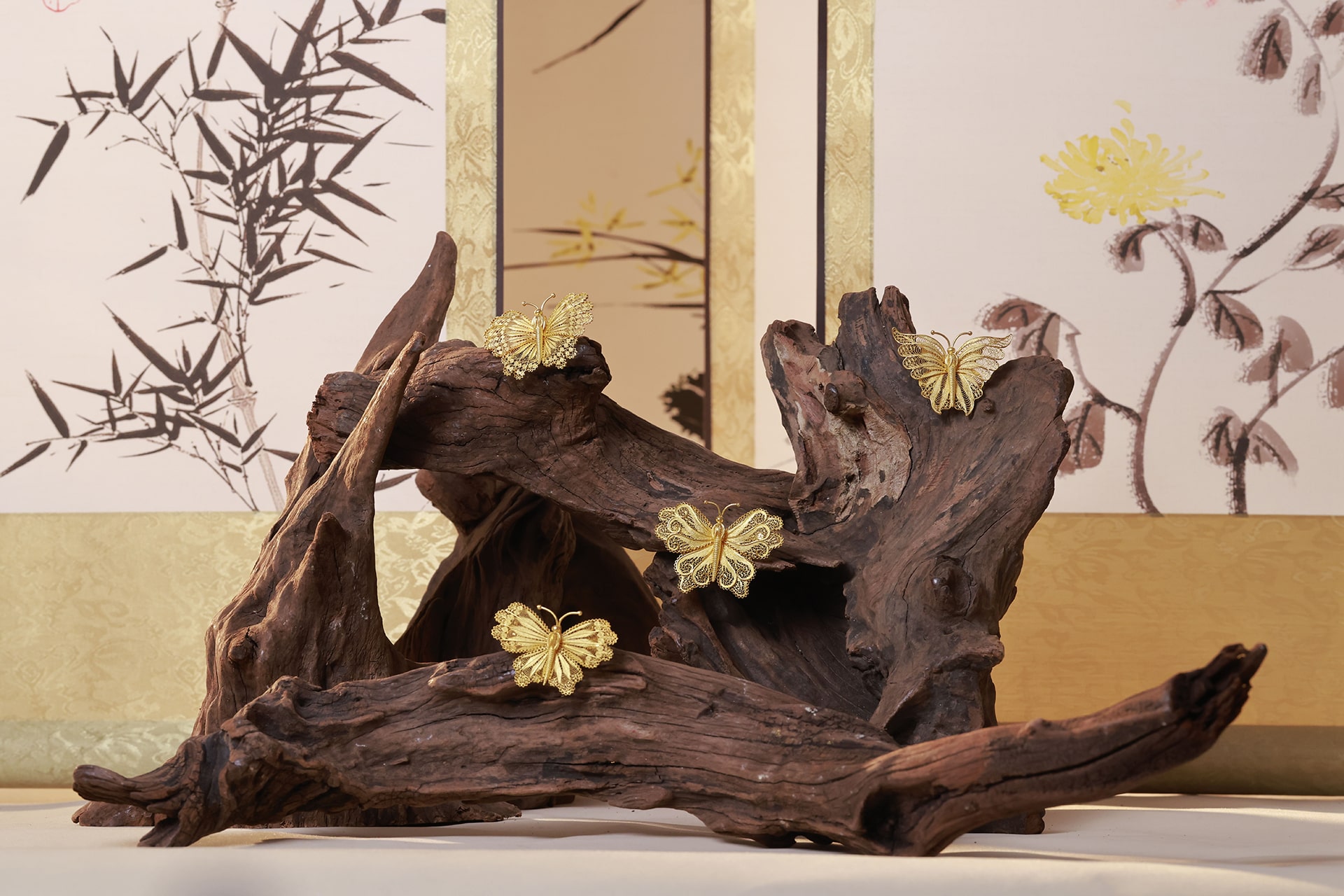 Photo of gold butterfly brooches crafted by Borland.