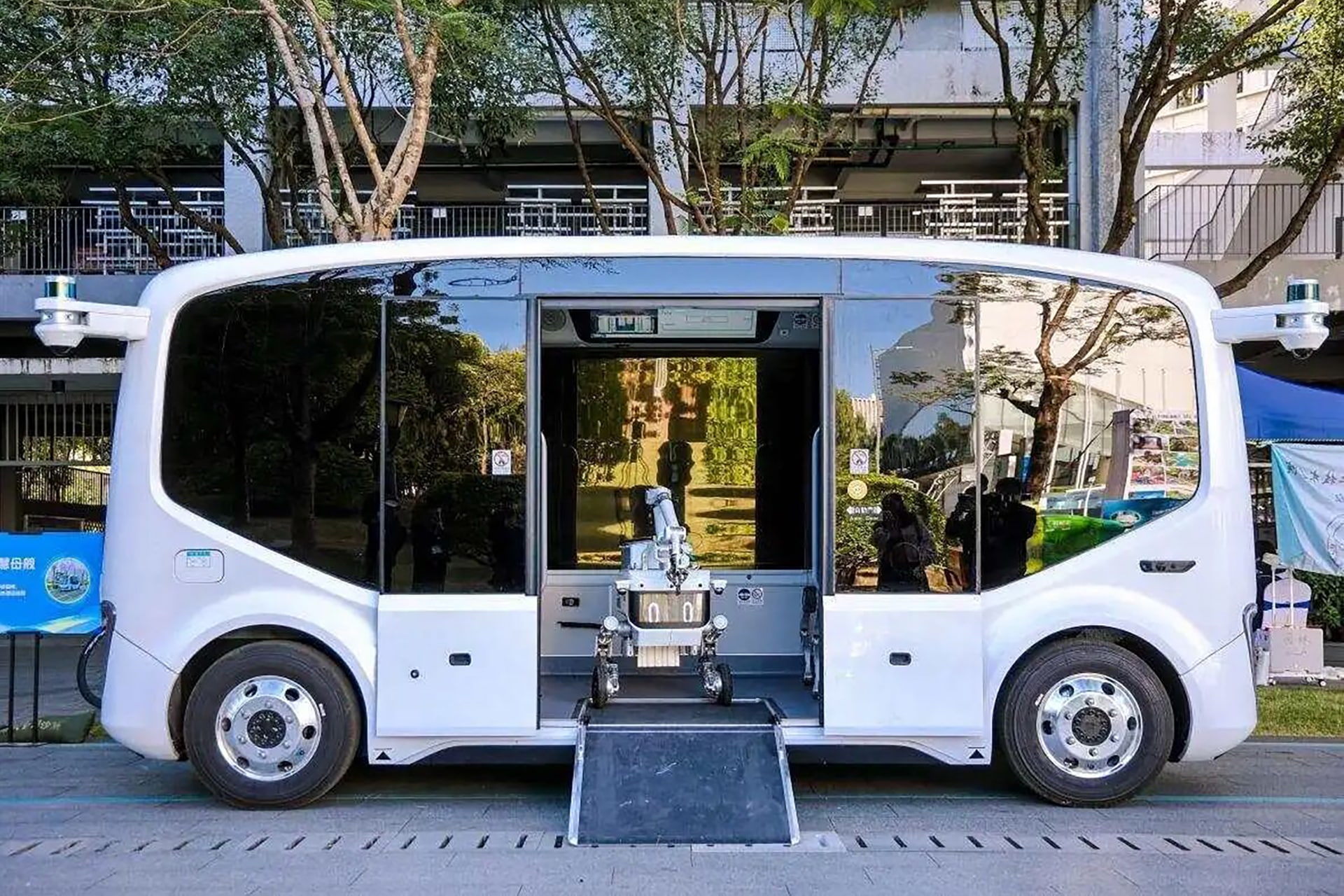 Photo of CowaRobot’s R0 robot, loaded onto a carrier vehicle.