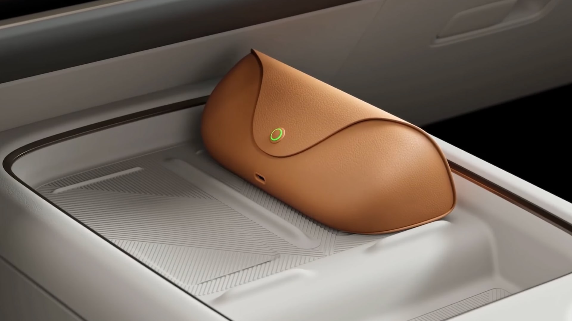 Image of a wireless charging case included with each pair of Livis glasses, designed to fit into the cabin of Li Auto cars.