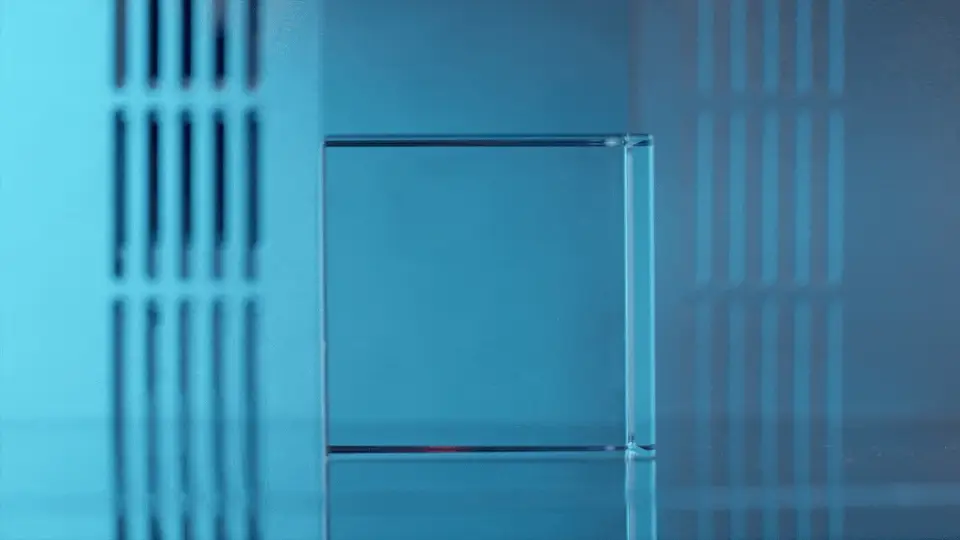 XLaserLab’s E3 engraver, focusing its laser beam inside a slab of crystal or glass, enabling the creation of 3D designs within the material.