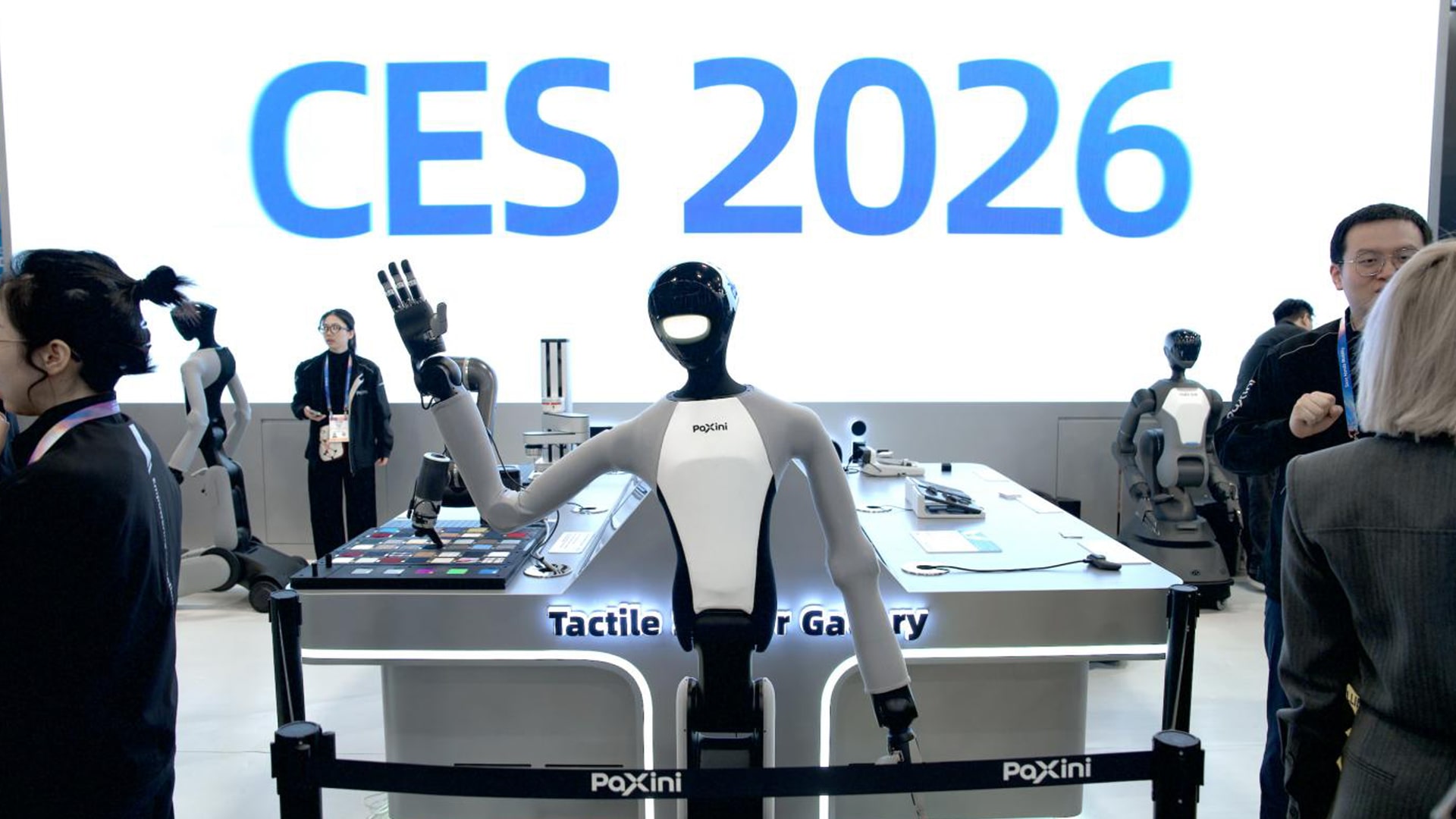 Photo of PaXini’s TORA-DOUBLE ONE humanoid robot greeting visitors at the company’s CES 2026 booth.