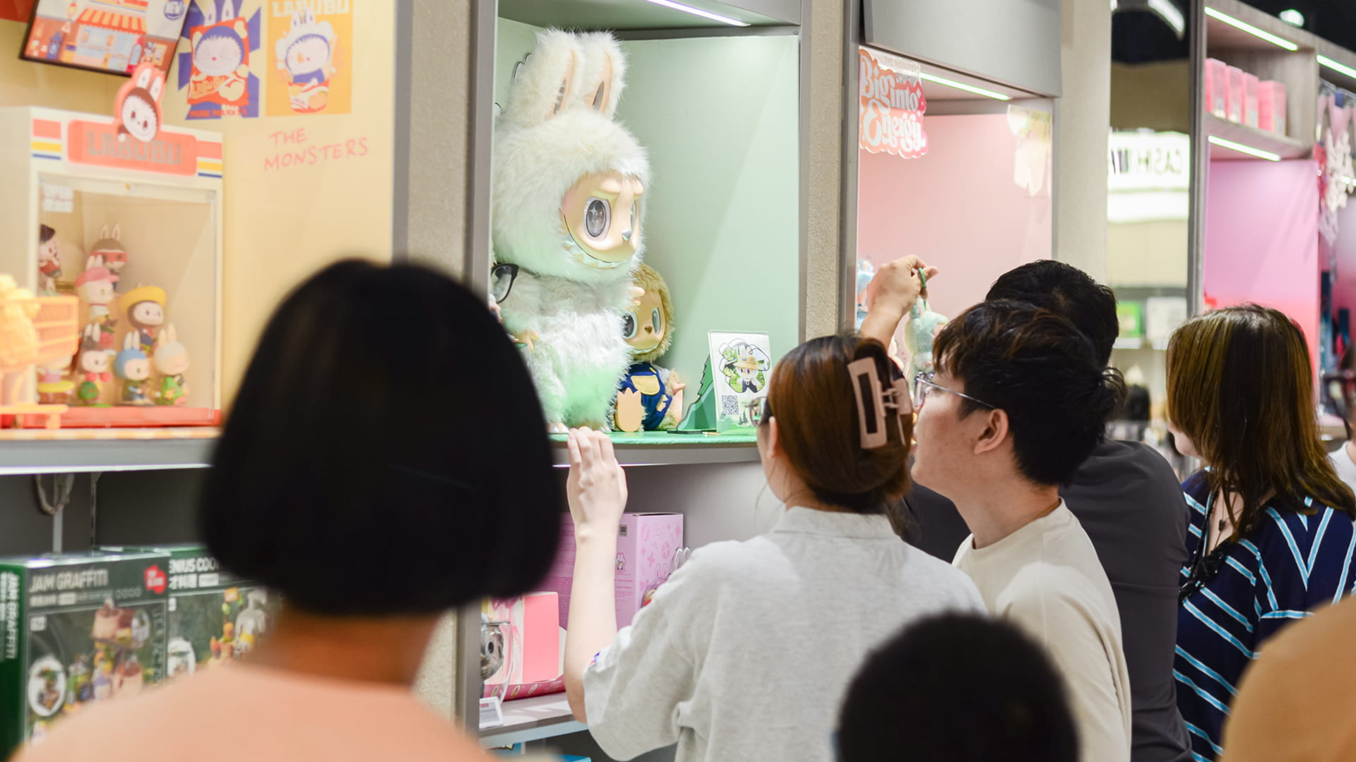 Photo shows shoppers browsing Labubu collectibles at a Pop Mart store in Jiangmen, Guangdong.