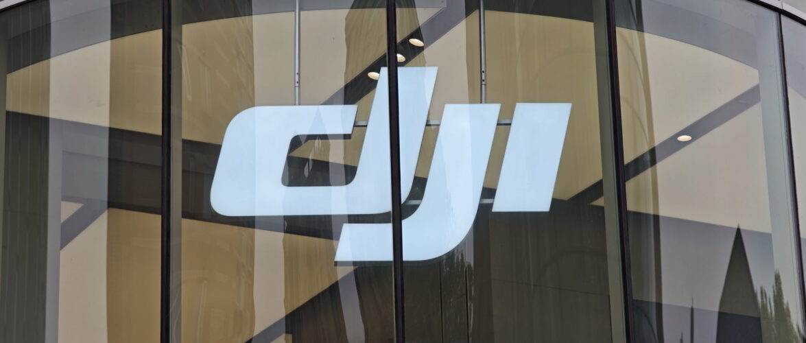 DJI’s logo on display at its flagship store in Xintiandi, Shanghai. Photo source: Dreamstime (<a href="https://www.dreamstime.com/wgang818_info" style="border-bottom: 1px solid #1266f1; text-decoration: none;" onmouseover="this.style.color='#1266f1'" onmouseout="this.style.color=''">Gang Wang</a>, ID: 371187944).