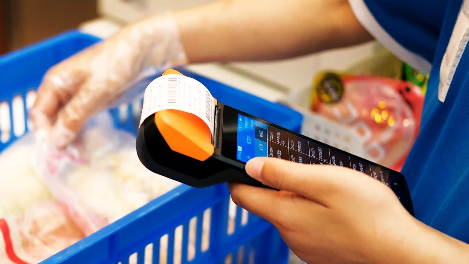 Photo shows a FamilyMart staff member using the V2 Pro.