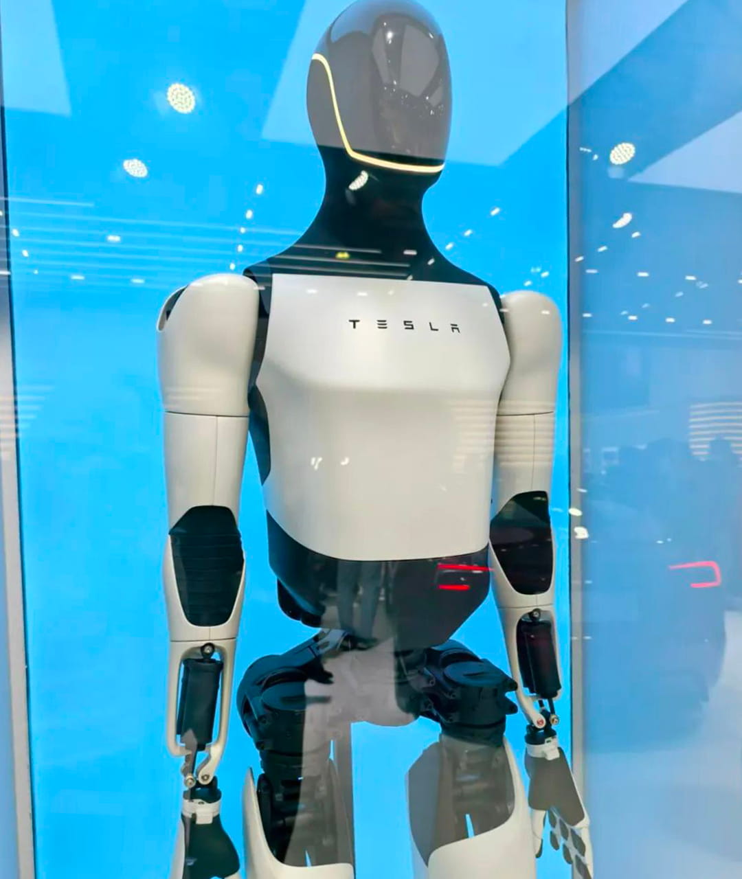 Photo shows Tesla’s Optimus V3 humanoid robot on exhibit at AWE 2026. The robot was displayed behind glass panels and unavailable to interact with.