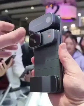 Detachable components of Tecno's concept phone being removed, including the camera module.