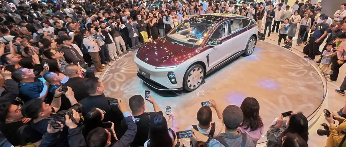 Visitors examine the Nio ET9 at the Beijing Auto Show on April 26. Photo source: Ju Huanzong (Xinhua).