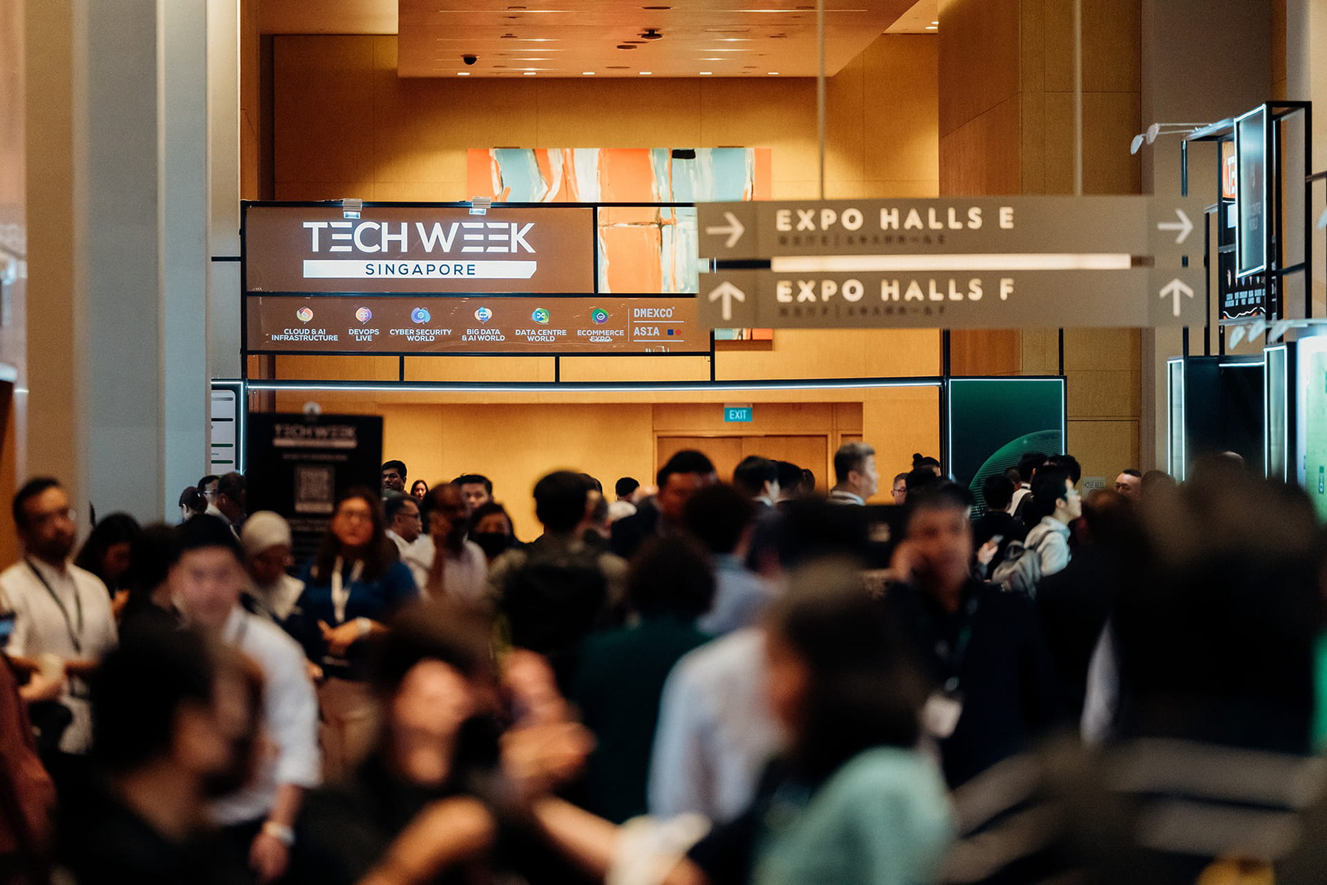 Photo shows visitors walking along the exterior of expo halls at Marina Bay Sands in Singapore during Tech Week Singapore 2025.