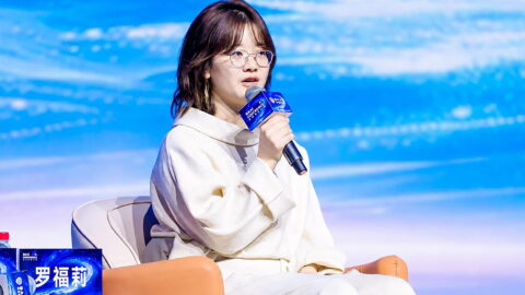 Luo Fuli, head of Xiaomi’s MiMo team, speaking during the Beijing Academy of Artificial Intelligence (BAAI) Conference on June 12. Photo source: 2026 BAAI Conference.