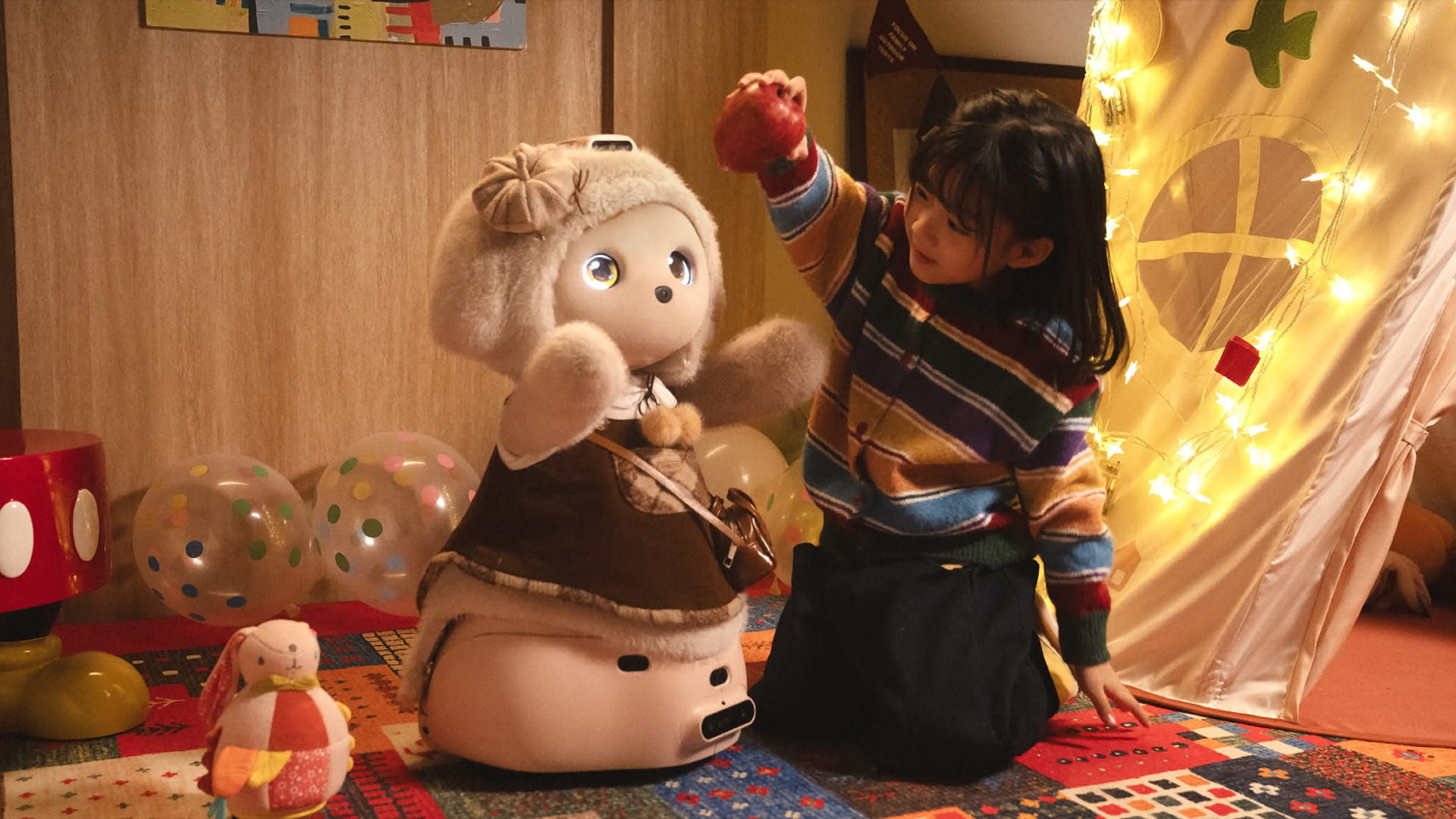 Image shows the Buboo 1 humanoid robot alongside a young child.