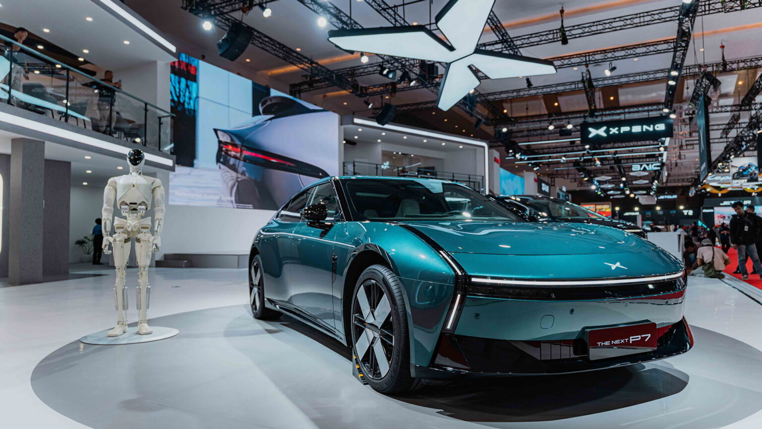 Iron, the humanoid robot developed by Xpeng, pictured alongside the Xpeng P7 at this year’s Indonesia International Motor Show. The robot has increasingly appeared at the company’s public showcases as Xpeng positions itself as a “physical AI” company. Photo courtesy of the company.