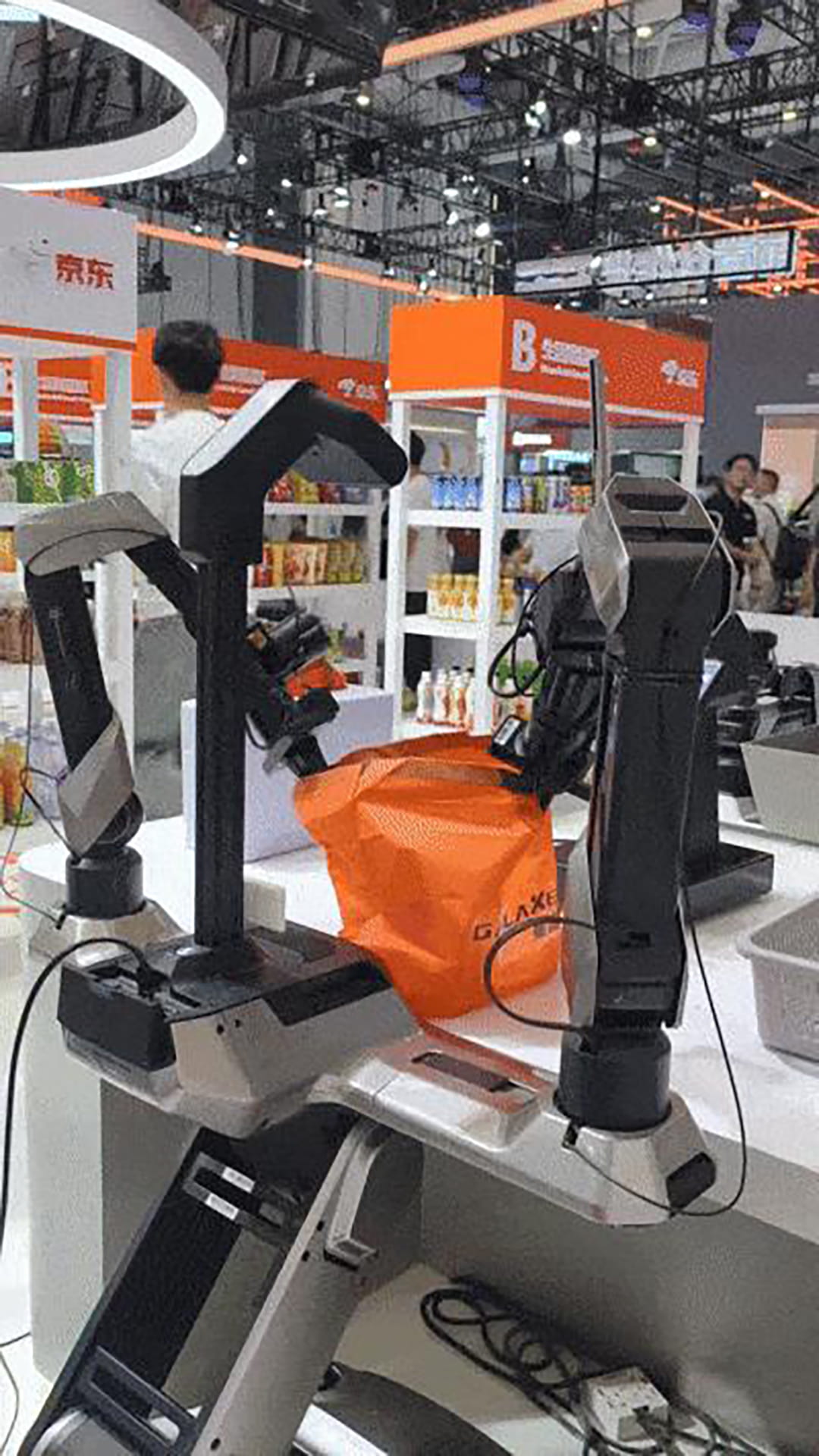 Photo shows Galaxea AI robots packing bags at World Robot Conference 2026.