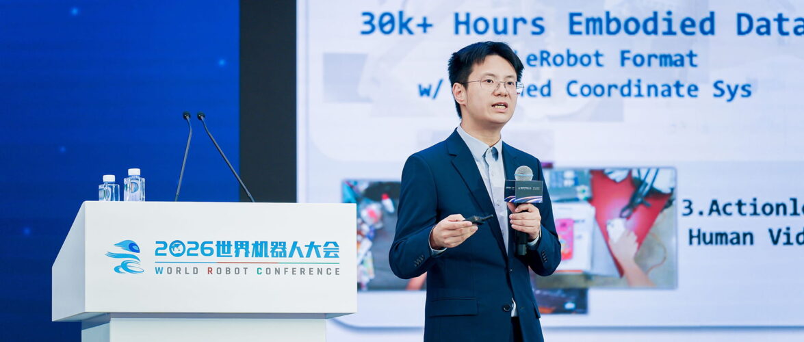 Wang He, founder and CTO of Galbot, speaking at the World Robot Conference (WRC) 2026. Photo source: Galbot.