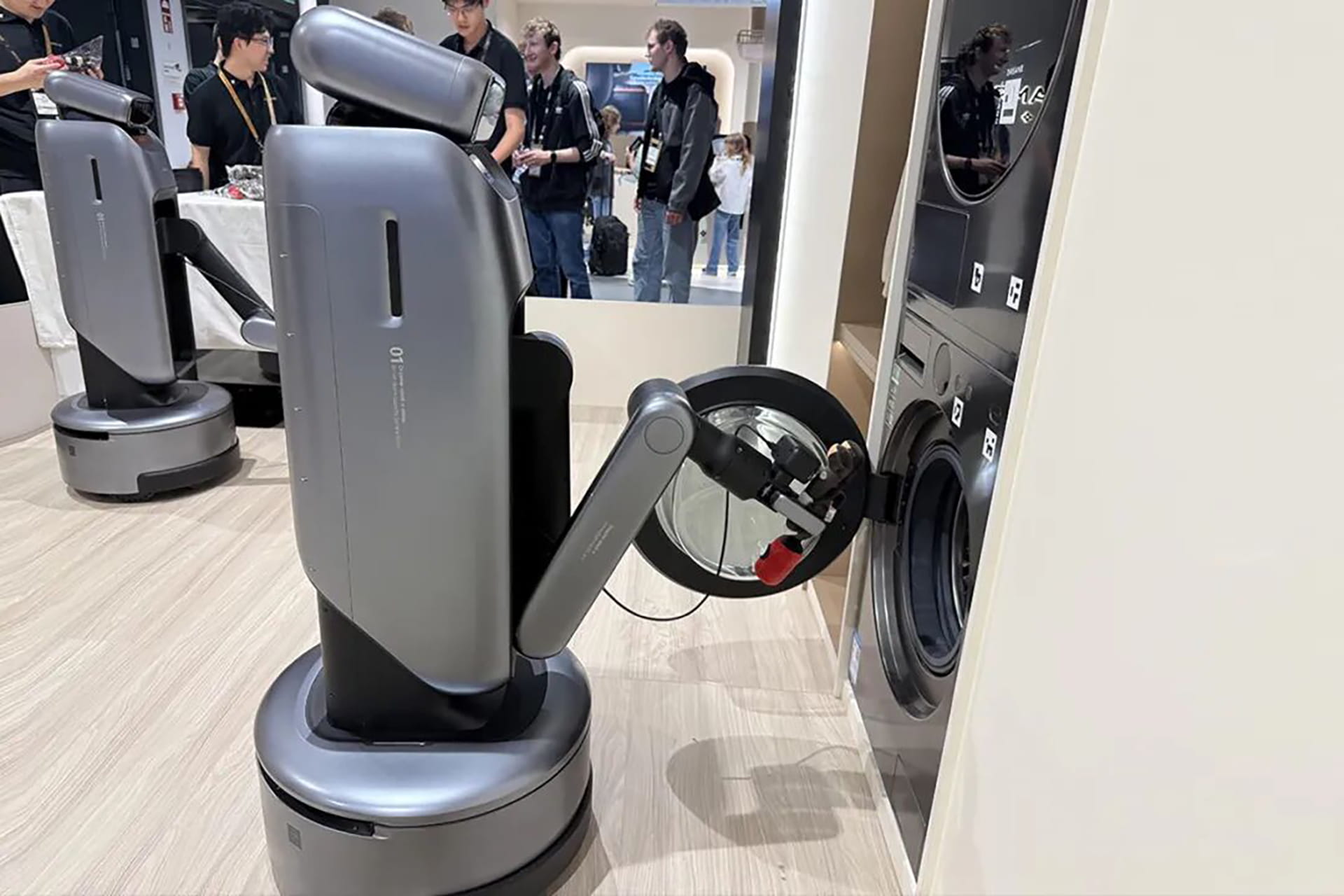 Photo of Dreame’s S1 robot, equipped with a single arm and wheels.