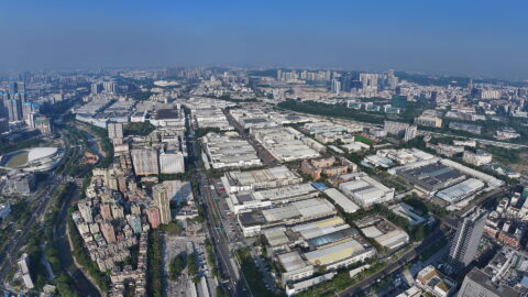 Longhua Science and Technology Park in Shenzhen is one of Foxconn’s major manufacturing sites. Its sprawling industrial complex contains factory buildings arranged in a dense grid. Photo source: Dreamstime (<a href="https://www.dreamstime.com/5822847_info" style="border-bottom: 1px solid #1266f1; text-decoration: none;" onmouseover="this.style.color='#1266f1'" onmouseout="this.style.color=''">5822847</a>, ID: 400939203).