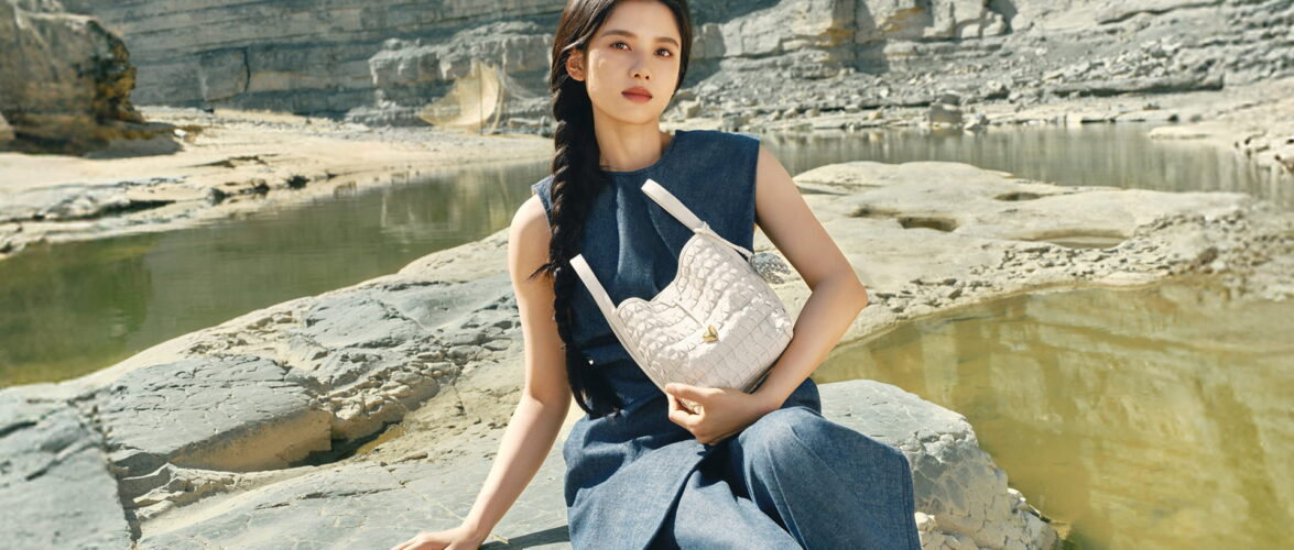 Chinese actress Zhang Jingyi carrying a Songmont bag as part of the brand's The Land Tells campaign. Photo source: Songmont.